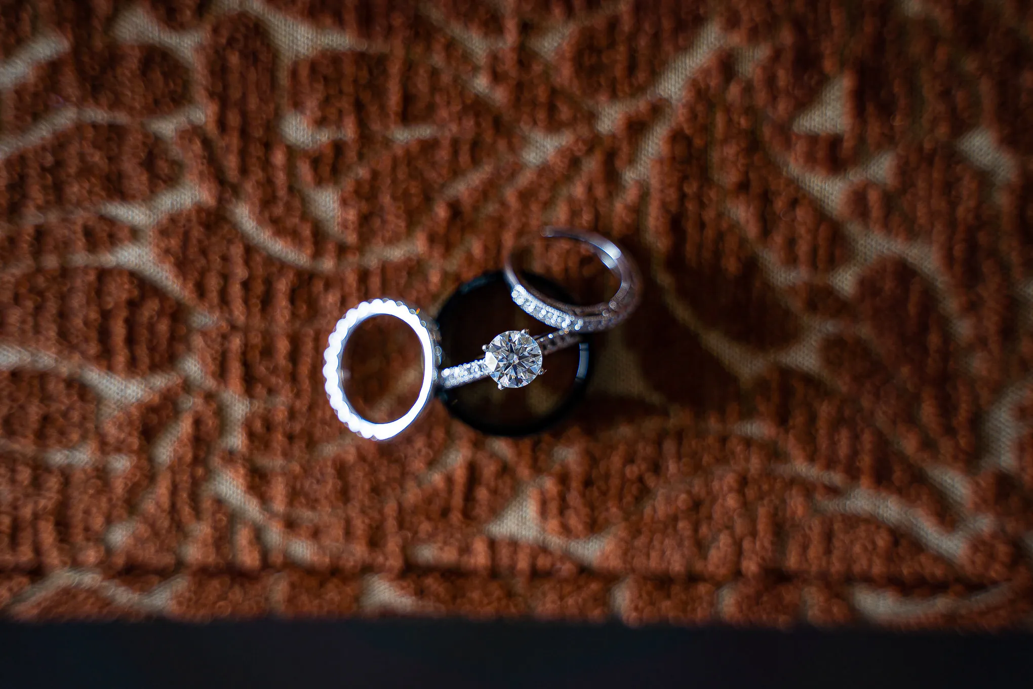 Wedding rings on a patterned fabric